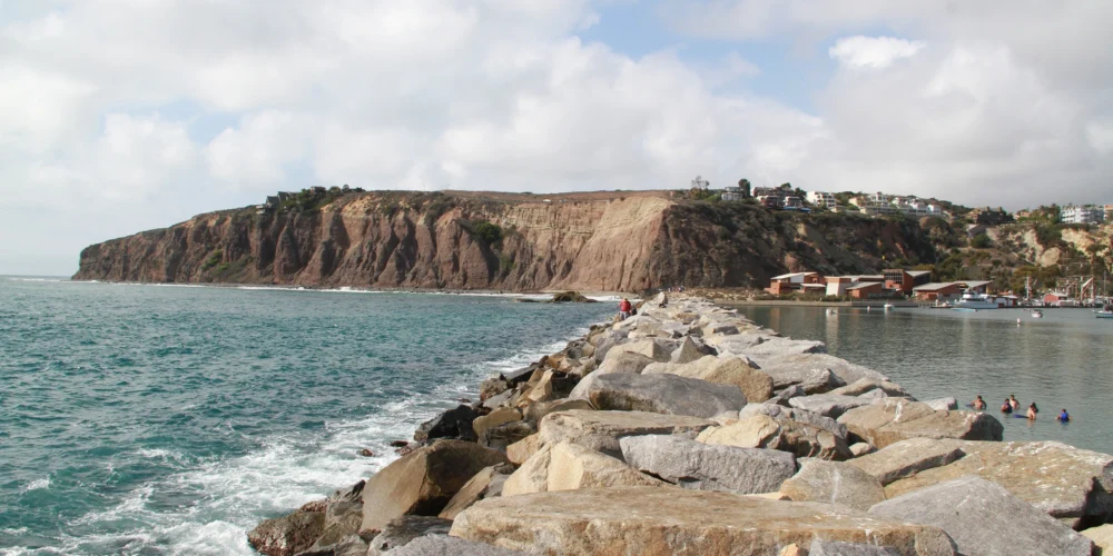 rocky harbor pier and cliffs