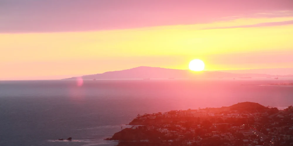 Californian coastal city and coastline with sunset
