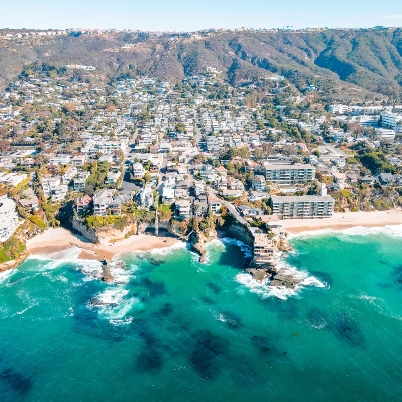 Aerial view of Californian coastal neighborhoods w sandy beaches and coastline