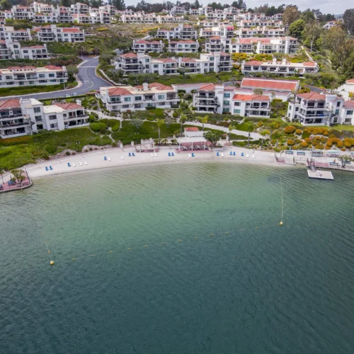 aerial of condos on edge of lake