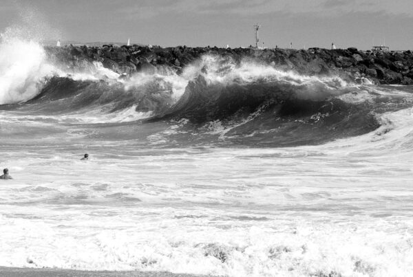 big surf with bodysurfers in wave