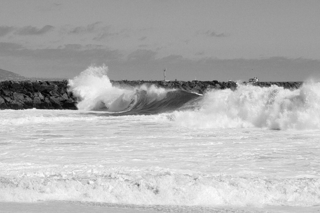 big surf with bodysurfers in wave